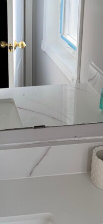 messy paint job in master bathroom and no curtain/blind for window