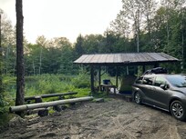 Plenty of space to park and set up a tent or two. Great view of the pond!