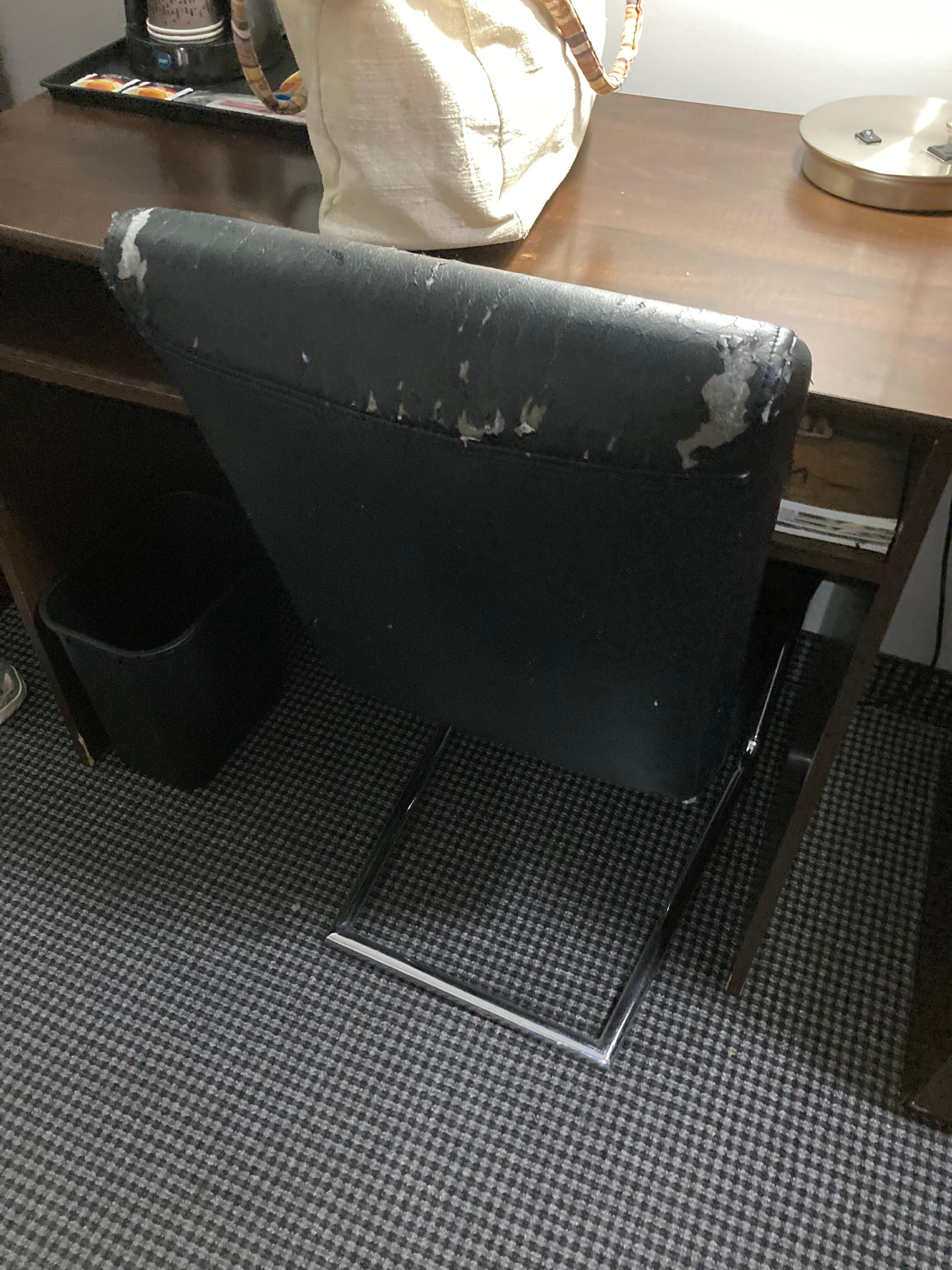 Desk chair was ripped and torn in places 