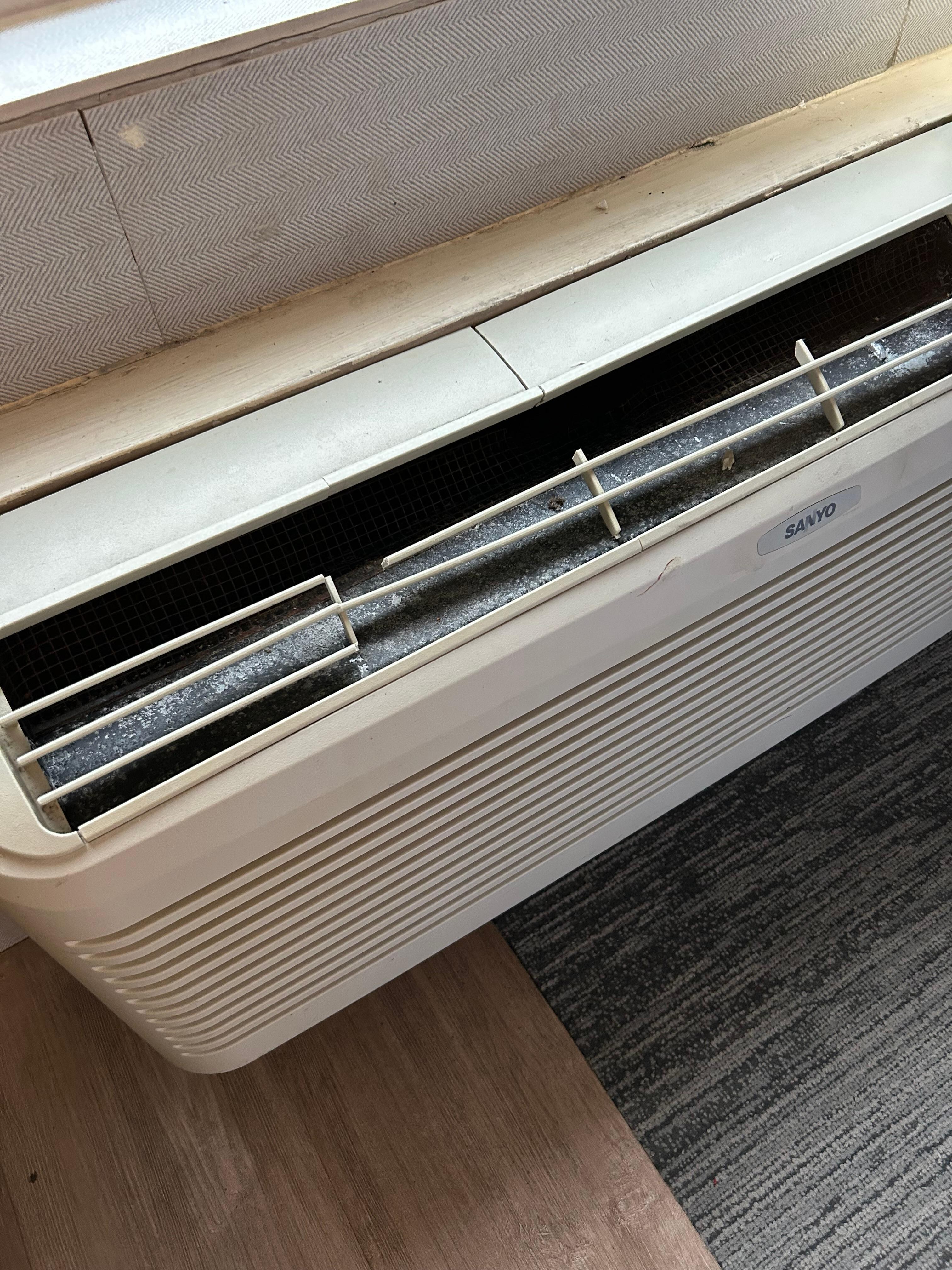 AC fan cracked and missing part of grill.