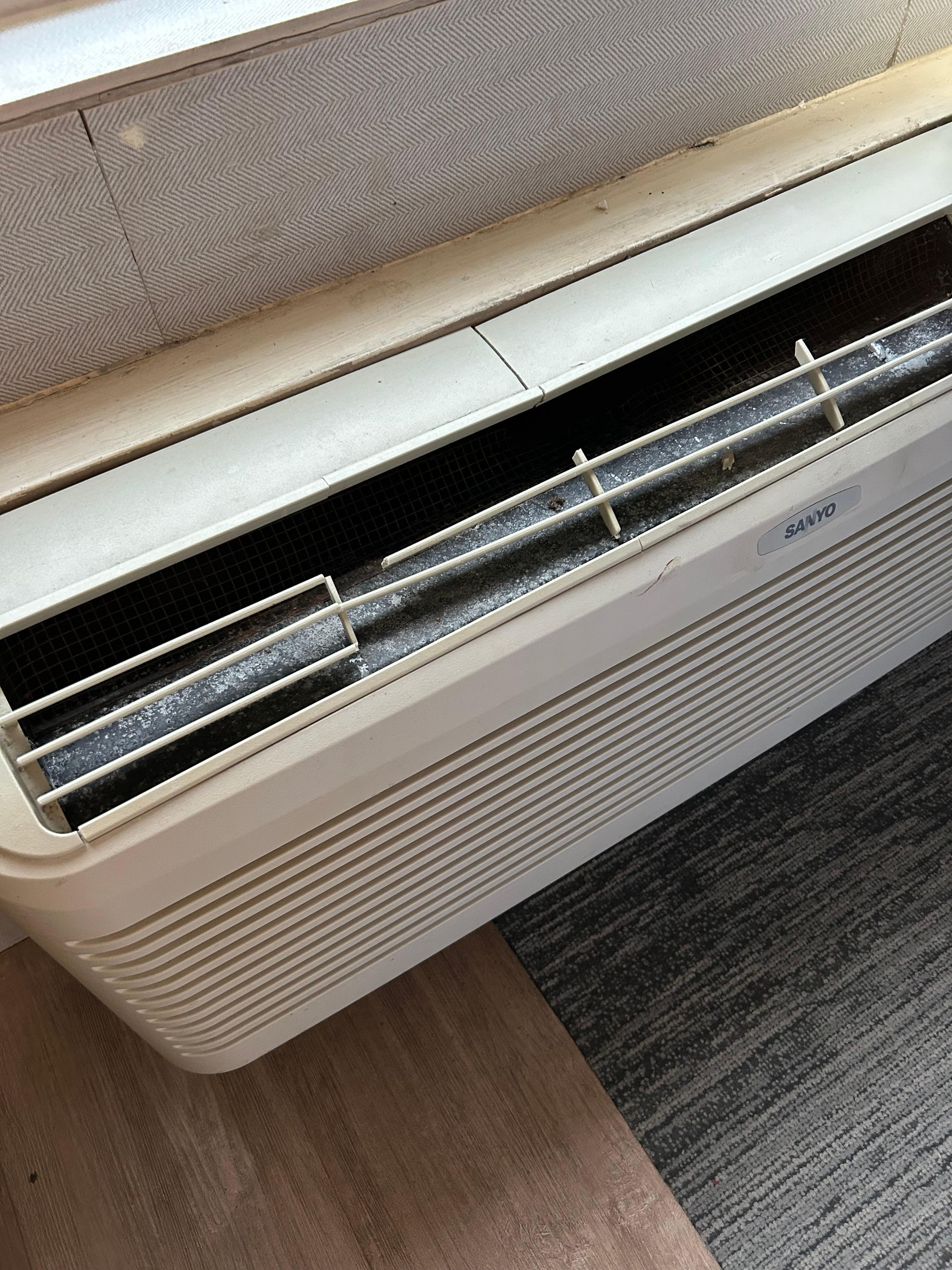 AC fan cracked and missing part of grill.