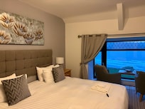 Comfortable room looking out to sea.