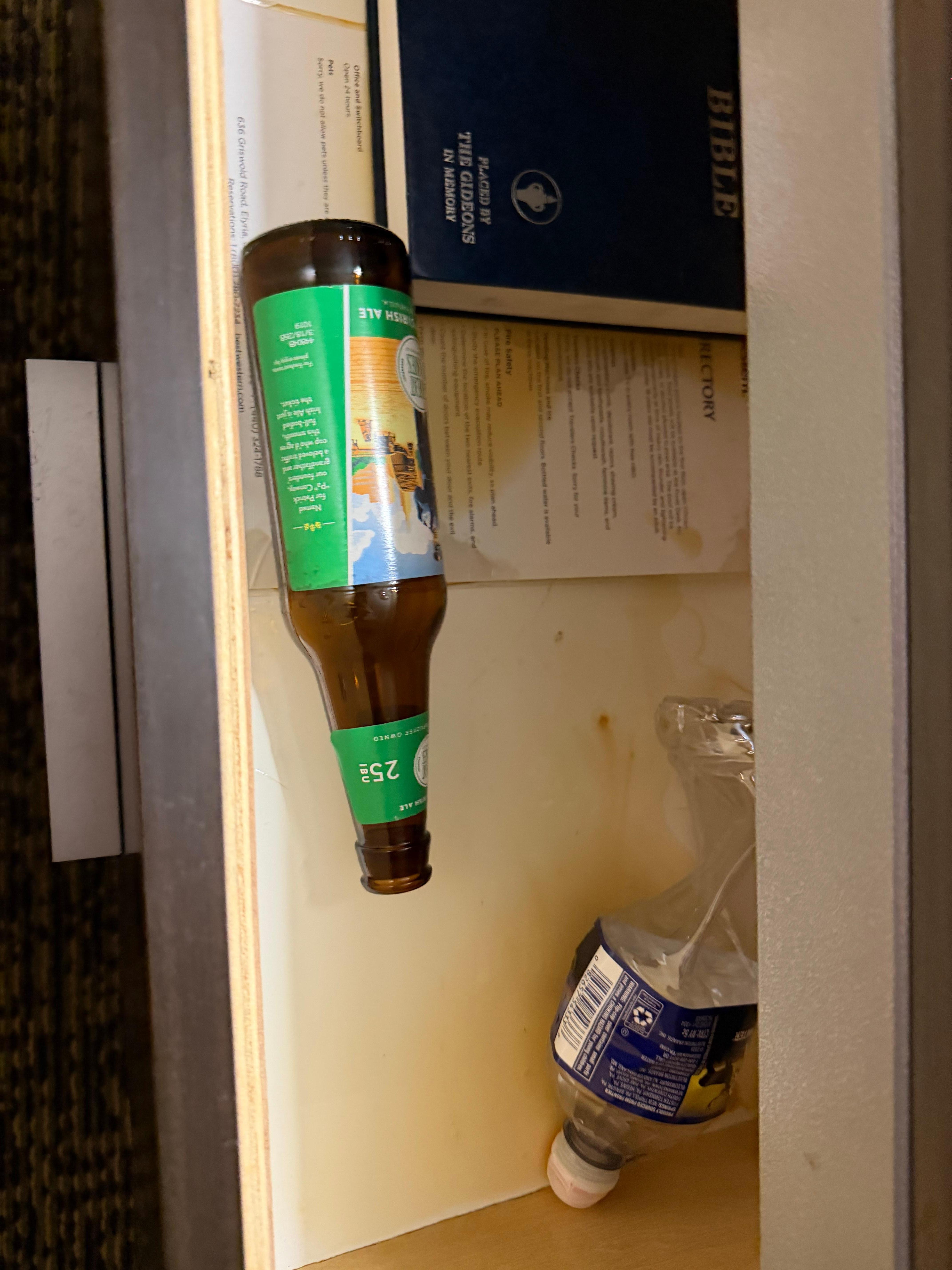 Spilled beer and garbage in nightstand