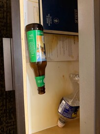 Spilled beer and garbage in nightstand