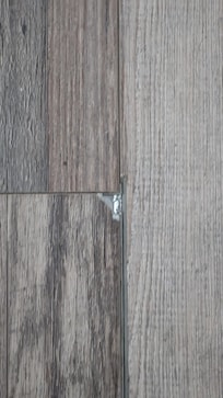 Example of chipped flooring in kitchen (catches on socks)