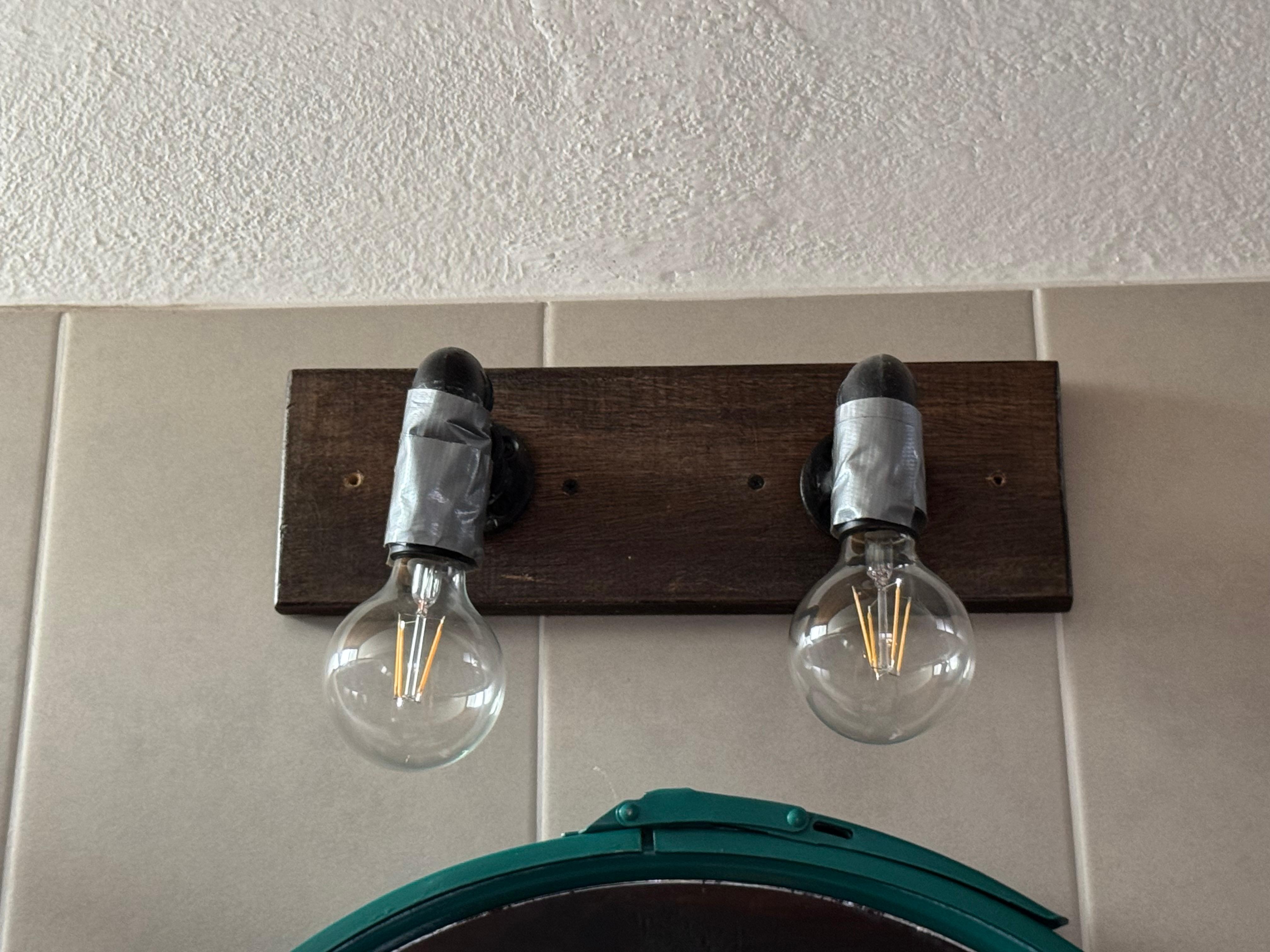 Duct taped lights in a $200 hostel room.   