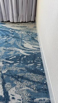 Drywall dust behind couch