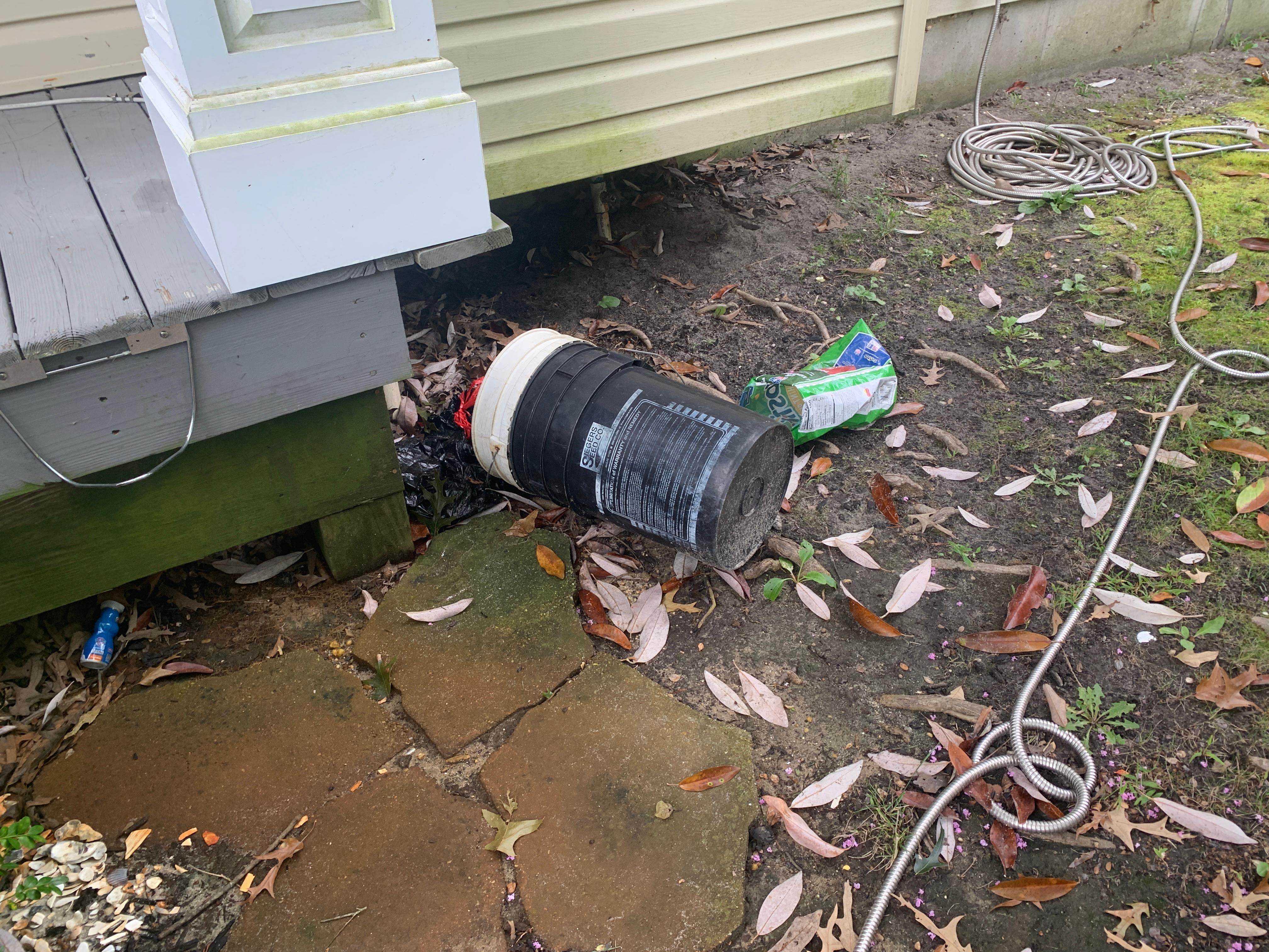 Garbage next to house