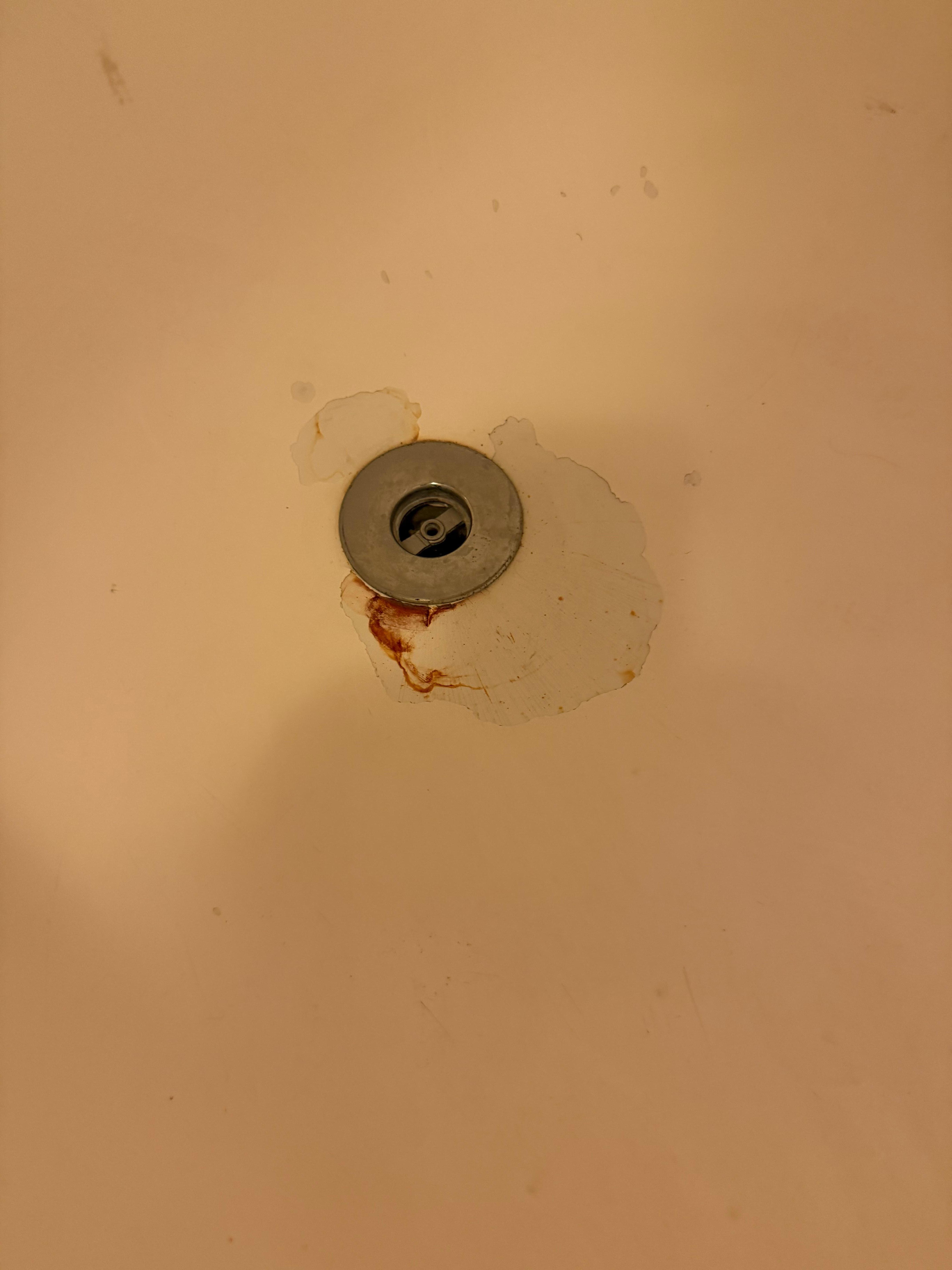 Blood stain in bath tub.