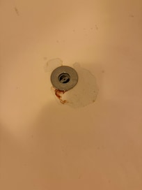 Blood stain in bath tub.