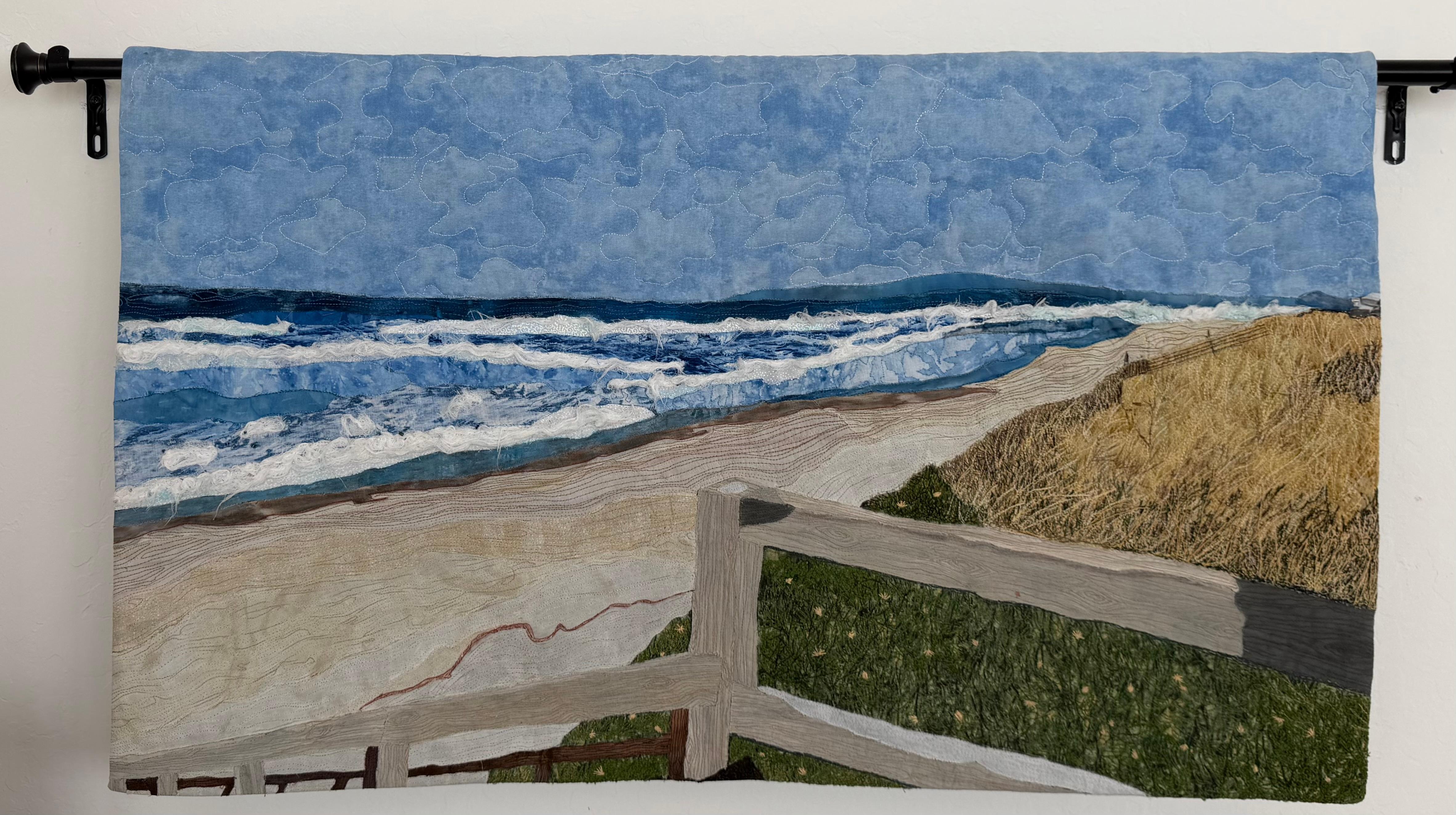 A beautiful thank you quilt hanging in the house.