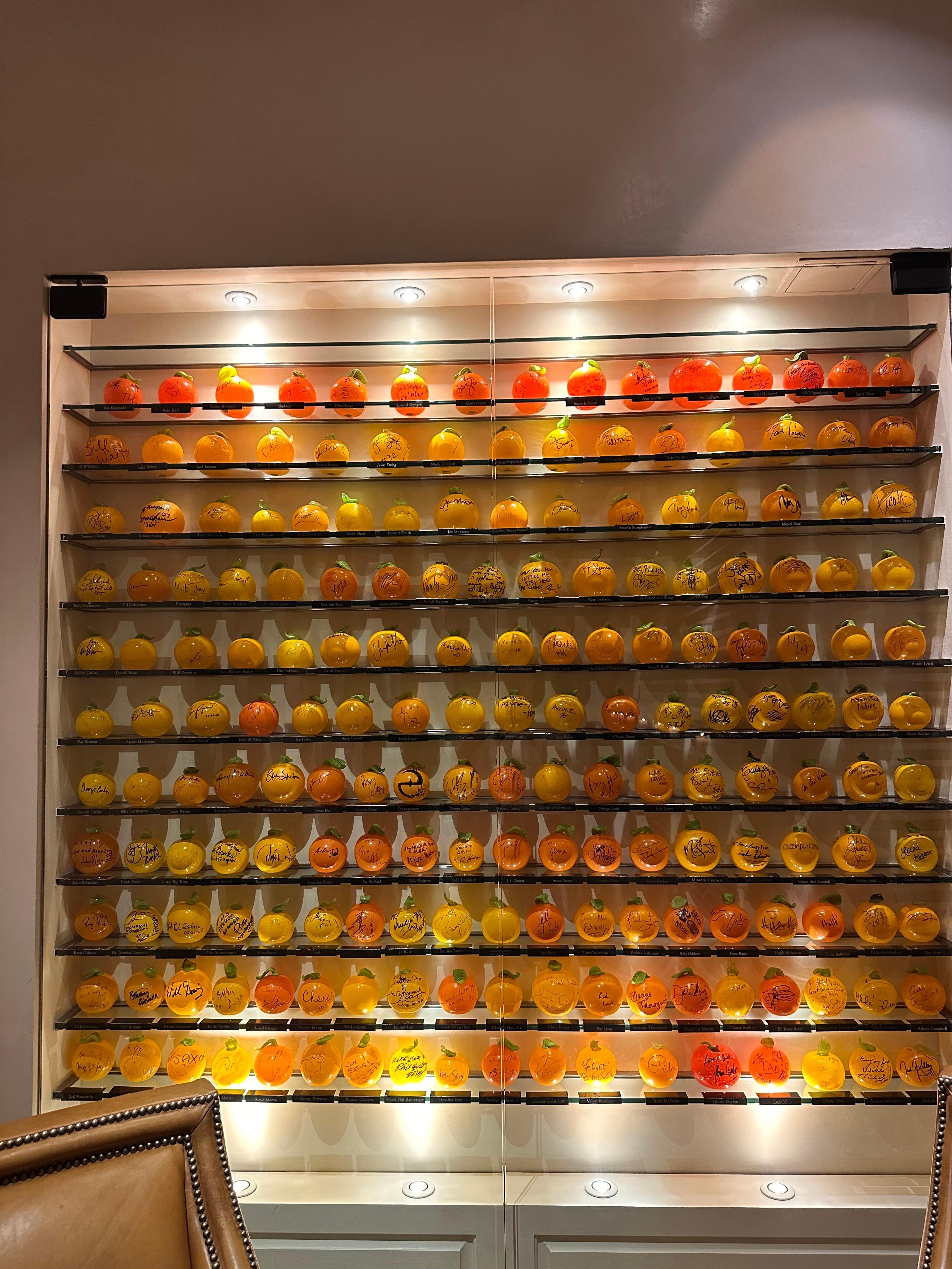 Signed glass oranges of famous people who have stayed at the hotel. 