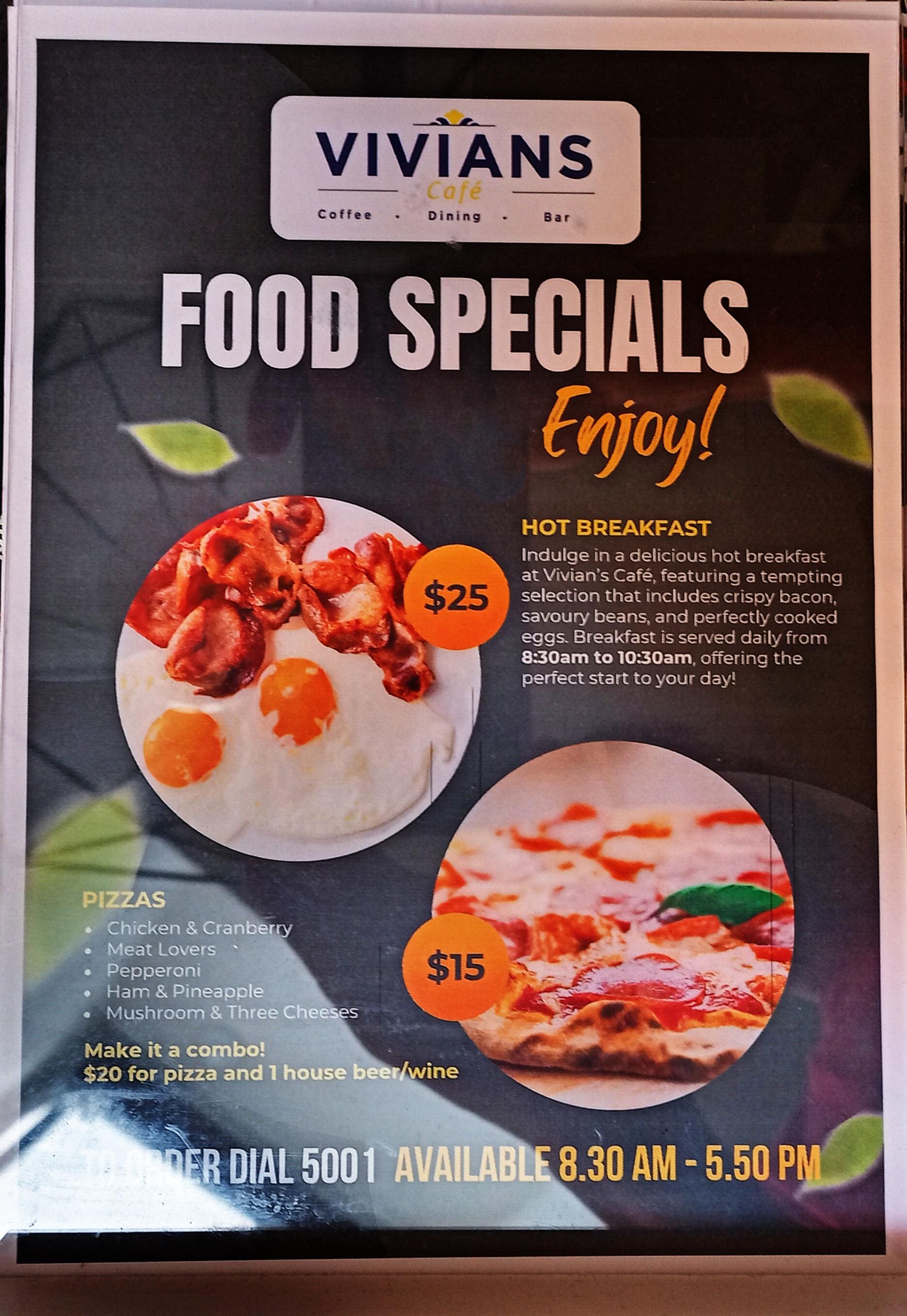 An ad in the room for Cafe Vivian, a non-existent restaurant. Do not be fooled by the offer of breakfast when booking this room!