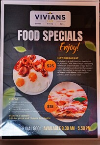 An ad in the room for Cafe Vivian, a non-existent restaurant. Do not be fooled by the offer of breakfast when booking this room!