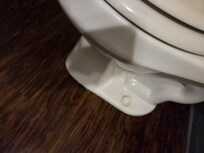 Urine stains around base of toliet