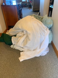 Piled up dirty blankets in the upper unit upon arrival