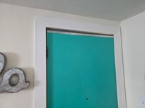 Looks like they installed a door sweep on the top of the door (there's one on the bottom as well, neither seal)