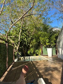 In the lounger outside the dome.