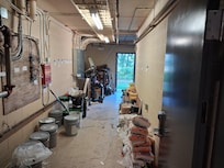 Sprinkler Test Room open to the outside and lower room corridor. No security.