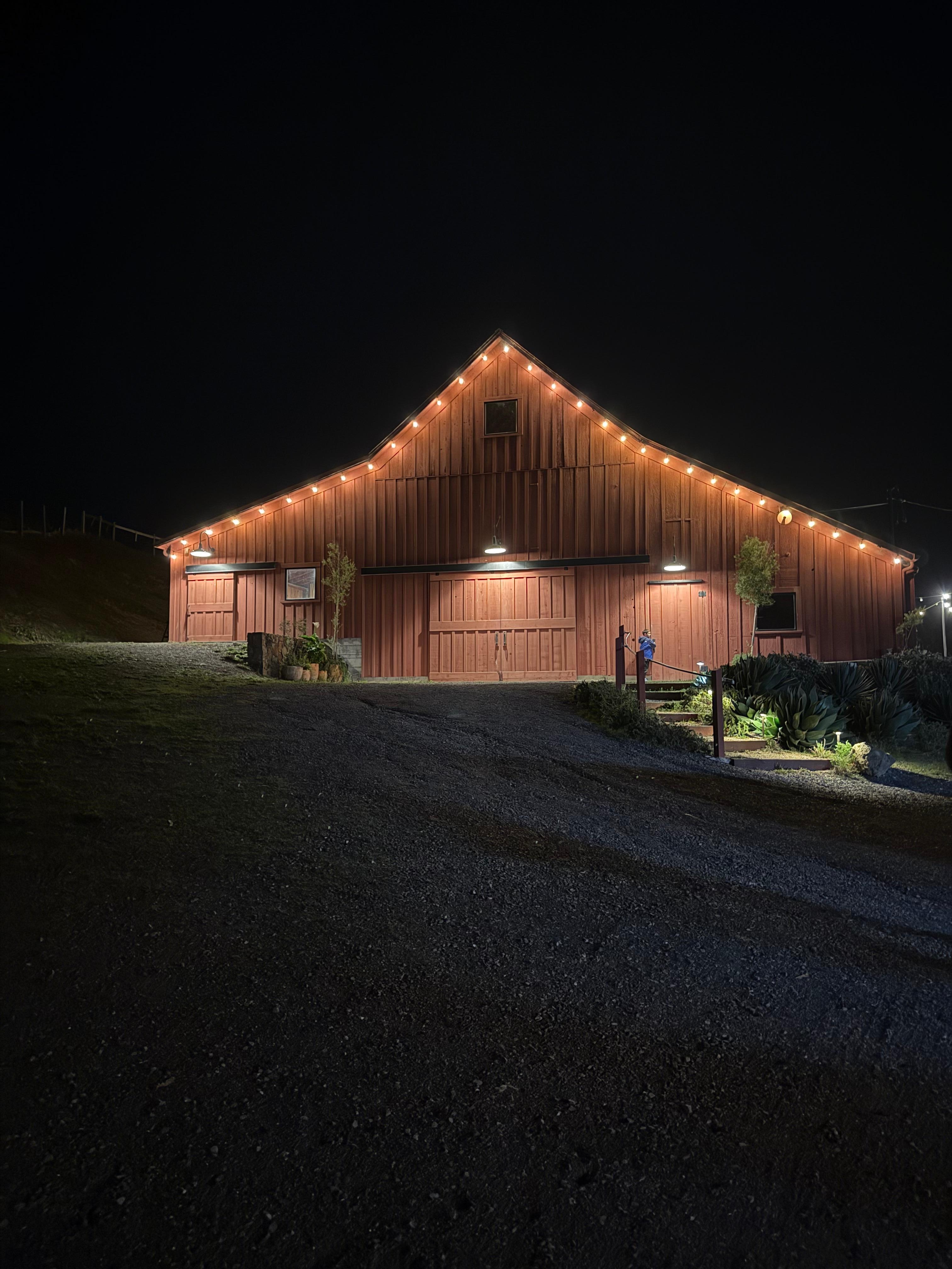A photo of the barn at night