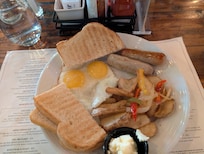 Eggs, toast, sausage, and potatoes