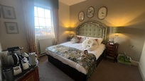 Country style spacious bedroom. Cosy bed. Pillow mist and bottled water a nice touch.