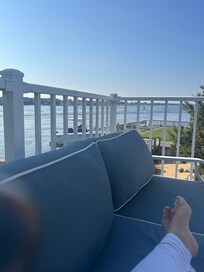 Lounging on cozy deck furniture with morning coffee!