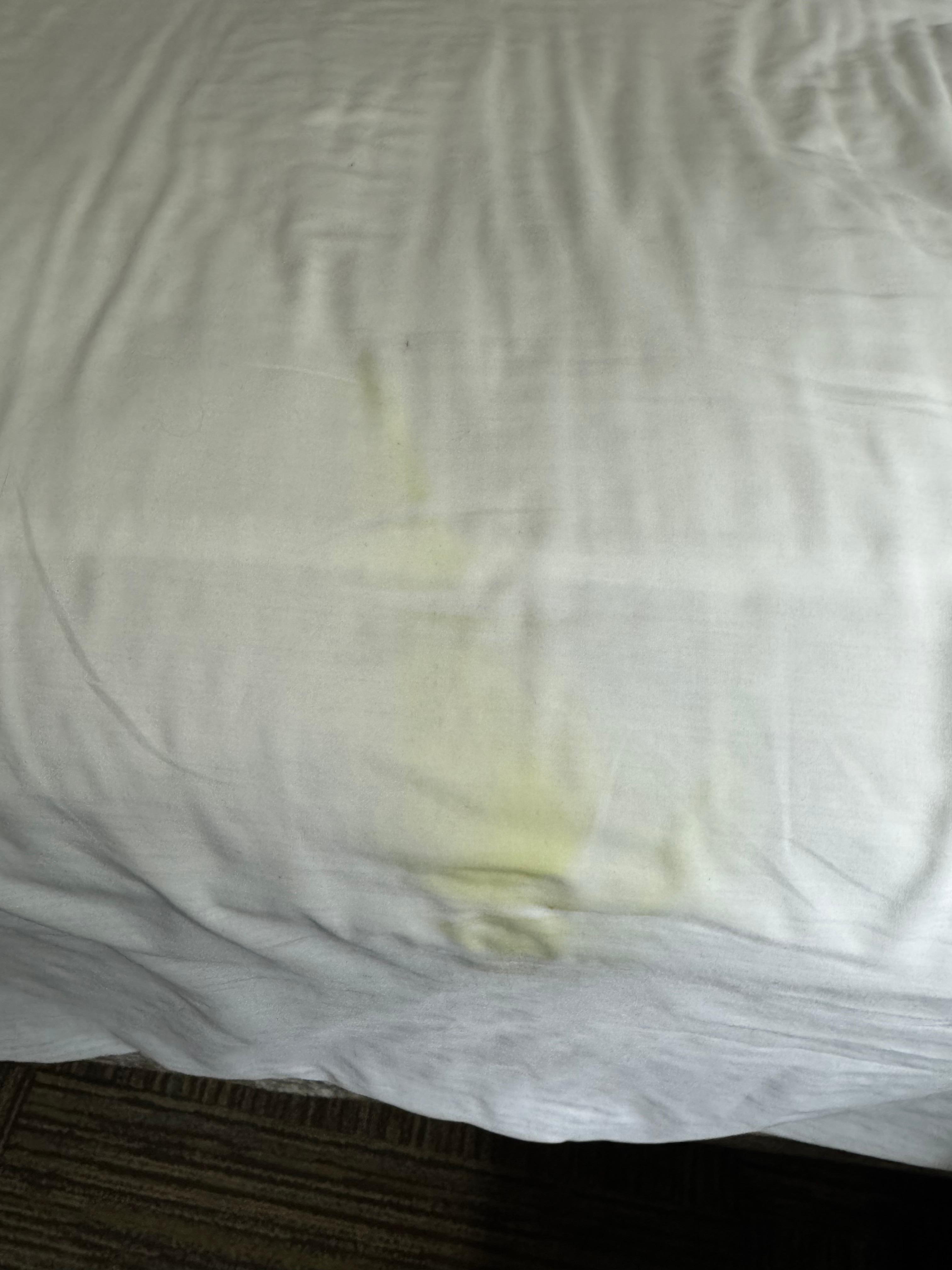 Large yellow stain on the fitted sheet