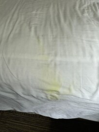 Large yellow stain on the fitted sheet