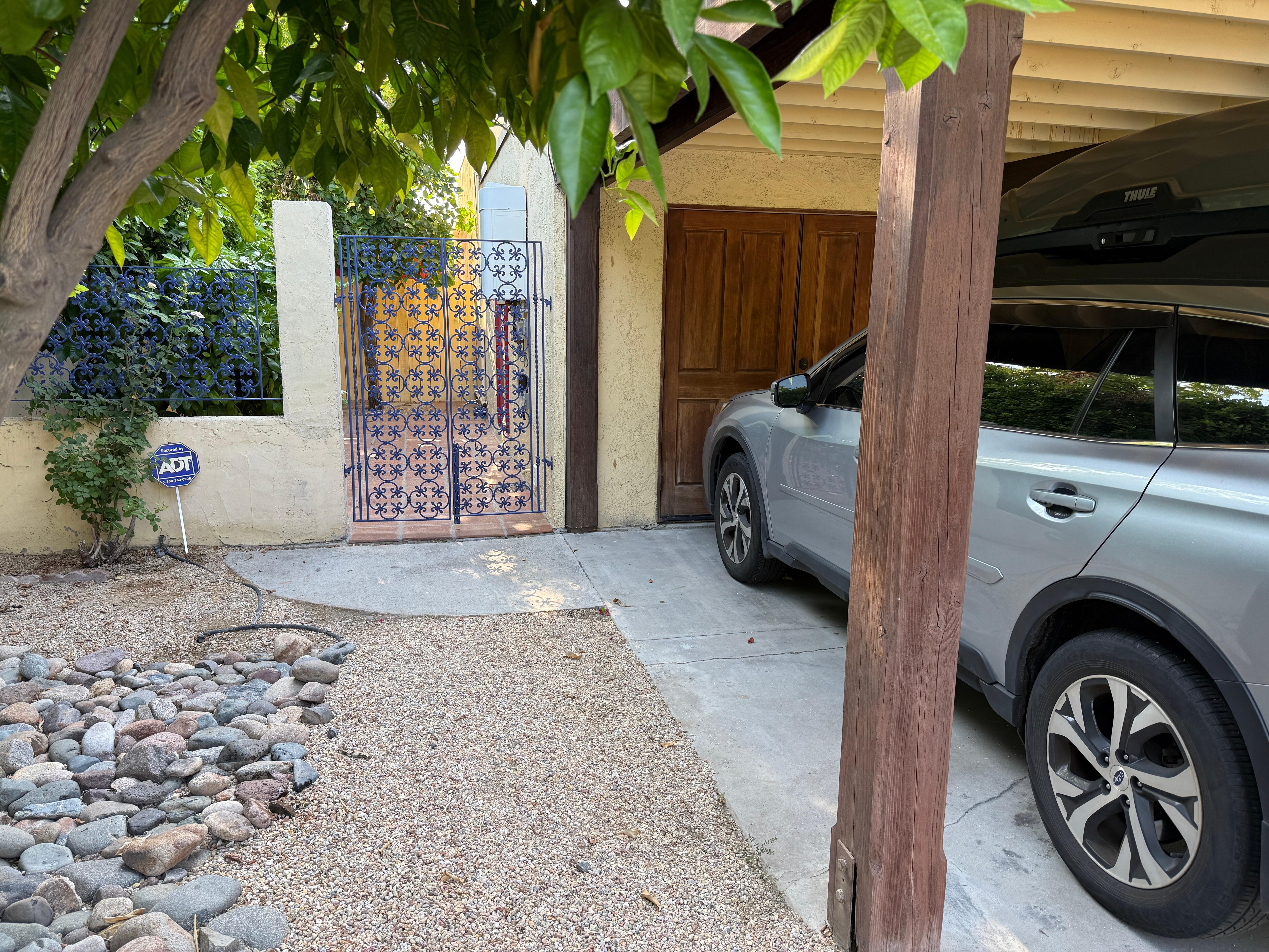 Covered parking, which is nice. Cute side gate.