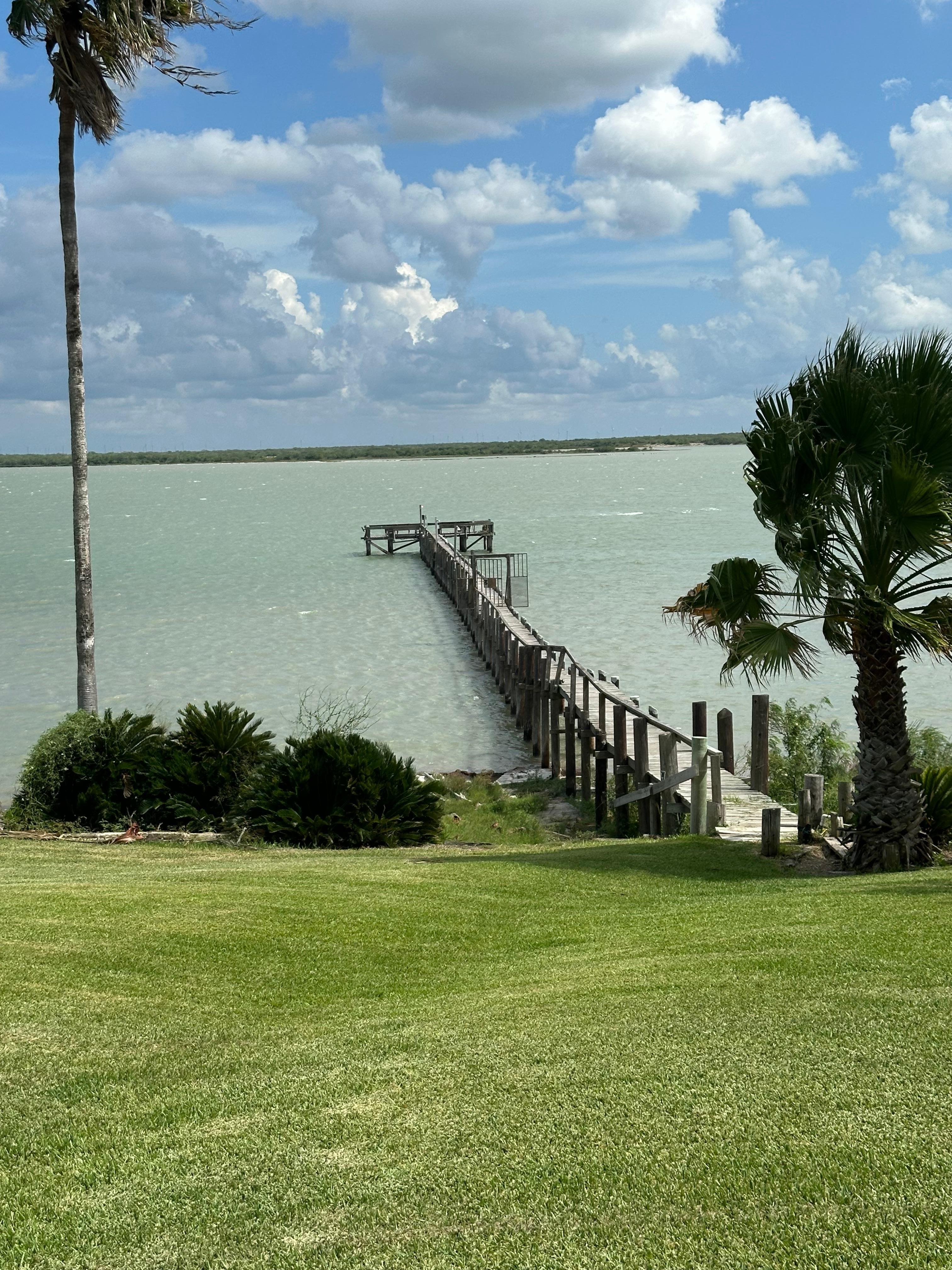 lush lawn with lots of outdoor seating options. 