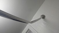 Broken shower rod where shower curtain won't stay closed