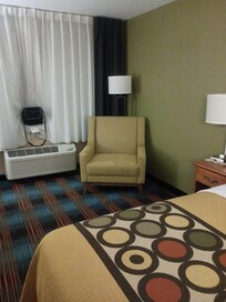 Chairs have been changed since the pictures were taken on the site. So no ottomans, but the chair was still very comfy and roomy.