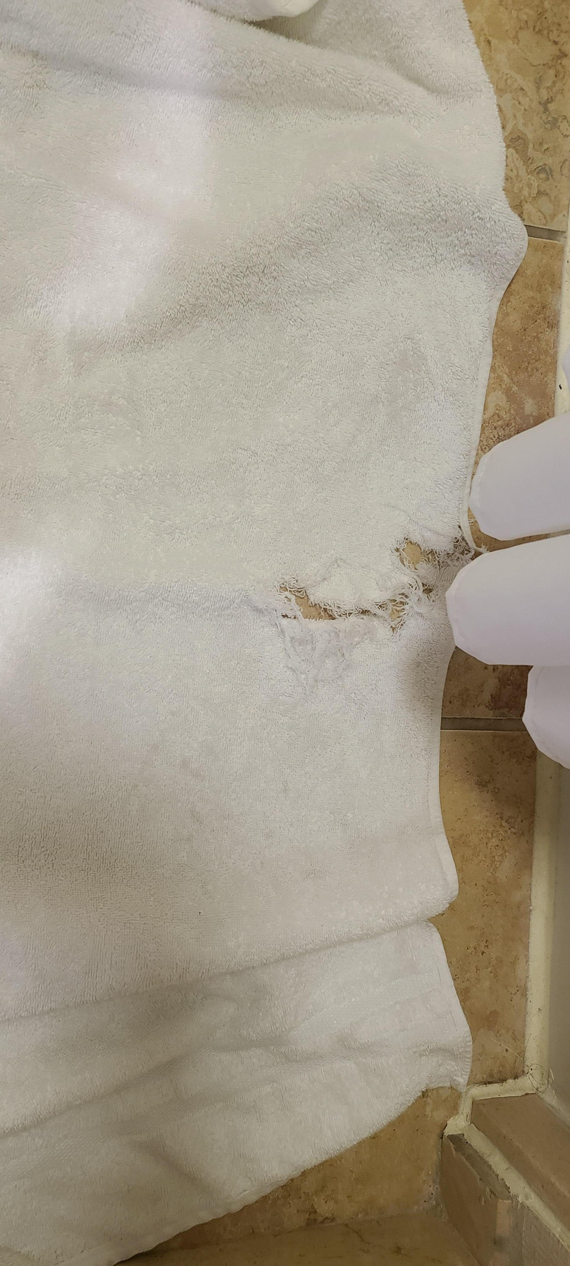 Holes and rips in towels, no spares provided. 