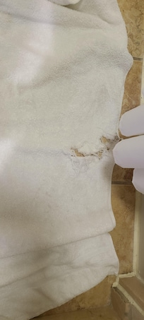 Holes and rips in towels, no spares provided.