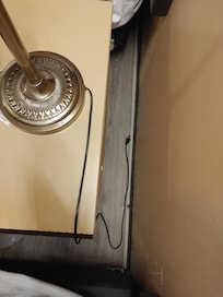 Found dirty baseboard trying to figure out why the light does not turn on. Asked front desk to check the lightbulb - no help. Had to charge my phone and use my alarm away from the bed as there were no plugs close to the bed.