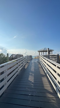 The entry to beach. We really appreciated the seating, shoe storage and hoses to rinse our feet and shoes