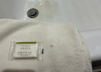 Towel is frayed and has holes.