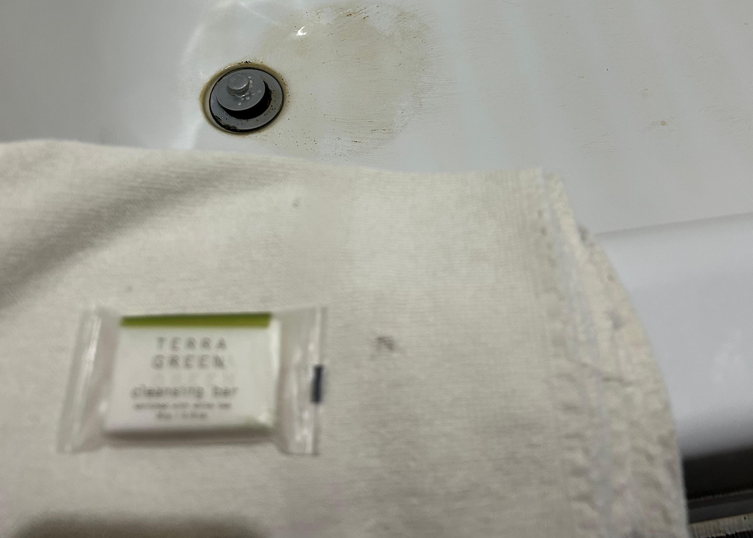 Towel is frayed and has holes. 