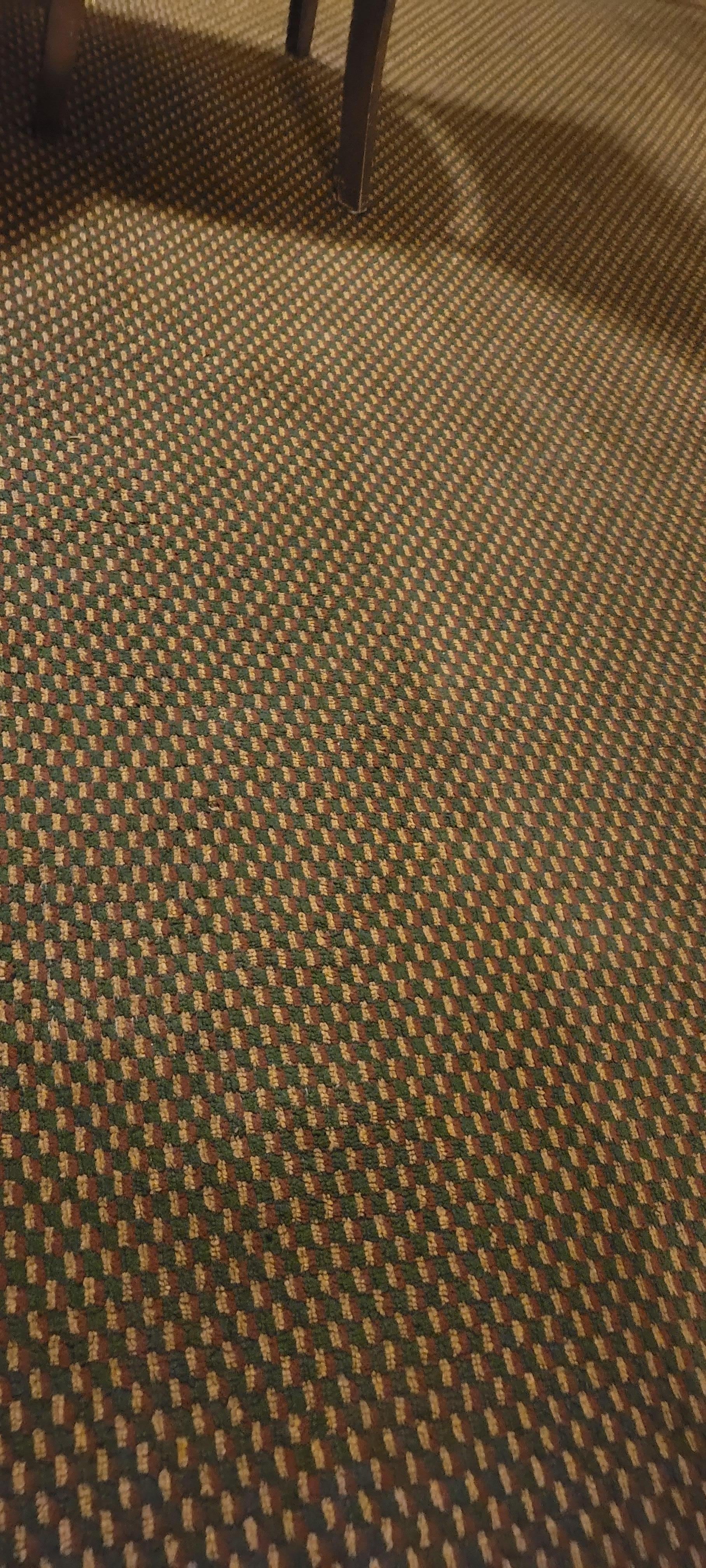 The sticky carpet smelled very bad and was very dirty.