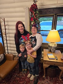 Family picture by Christmas tree