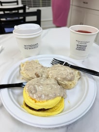 Sausage gravy, biscuits, sausage, coffee and juice