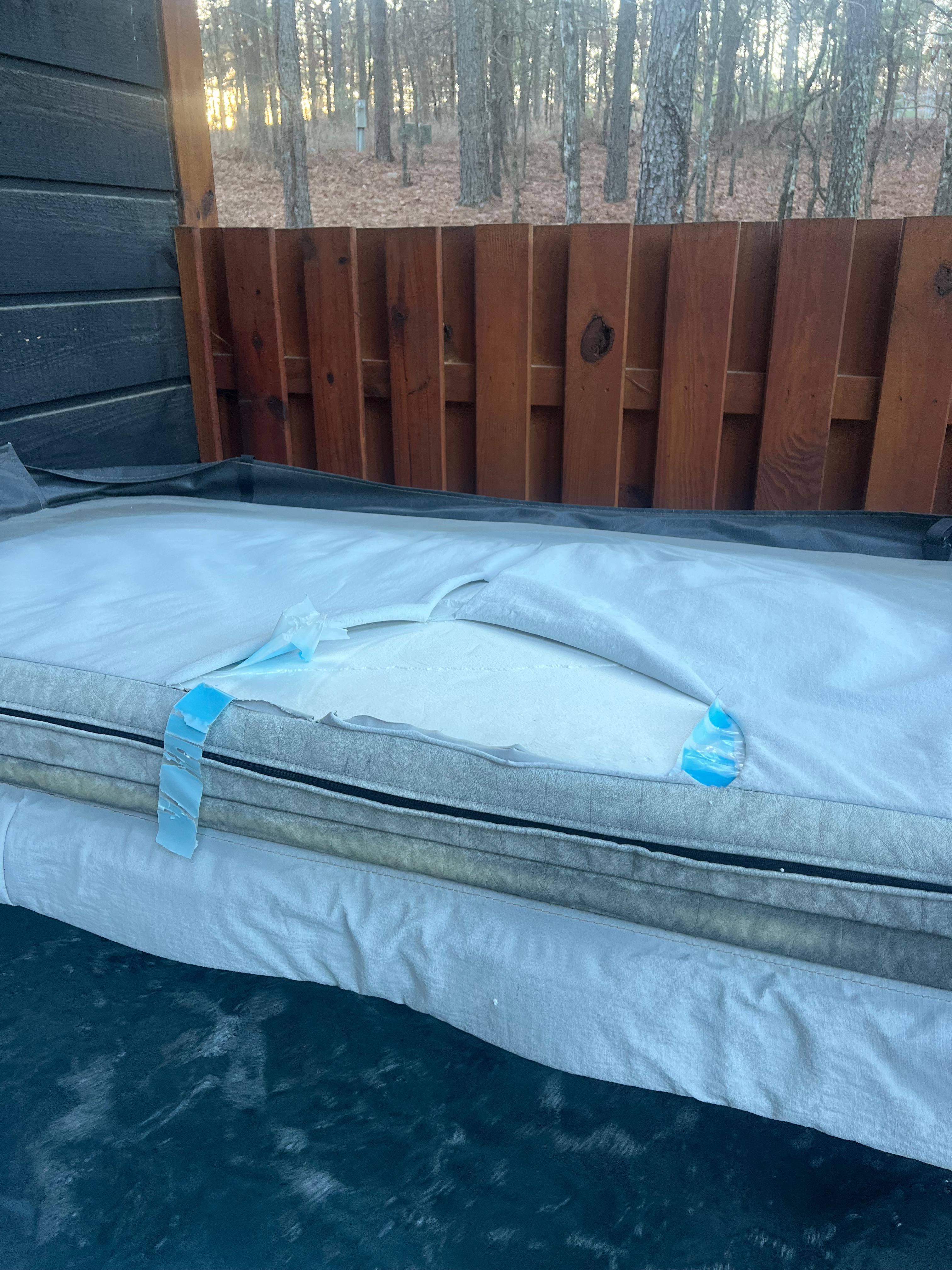 Torn hot tub cover that left plastic floating also in a previous review 