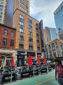 The hotel from the street. Mexixan restaurant tables outside.