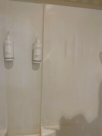 Stains on the shower walls.