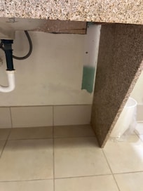 Unpainted portion under sink