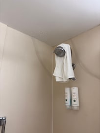 Shower head sprayed out of shower had to cover with towel