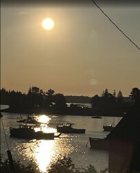 View from front porch of water and lobster boats.