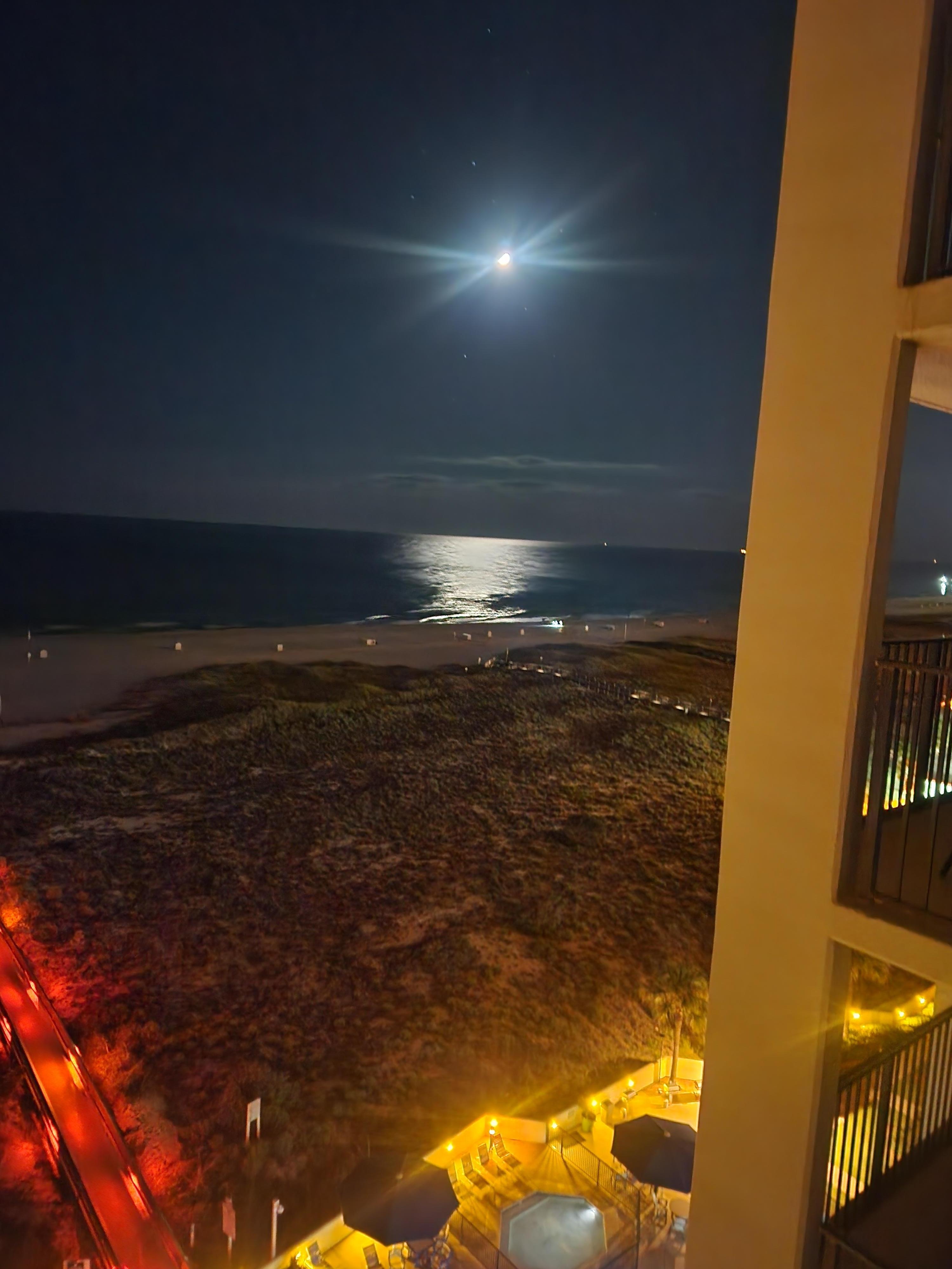 The moon over the water taken from the balcony 