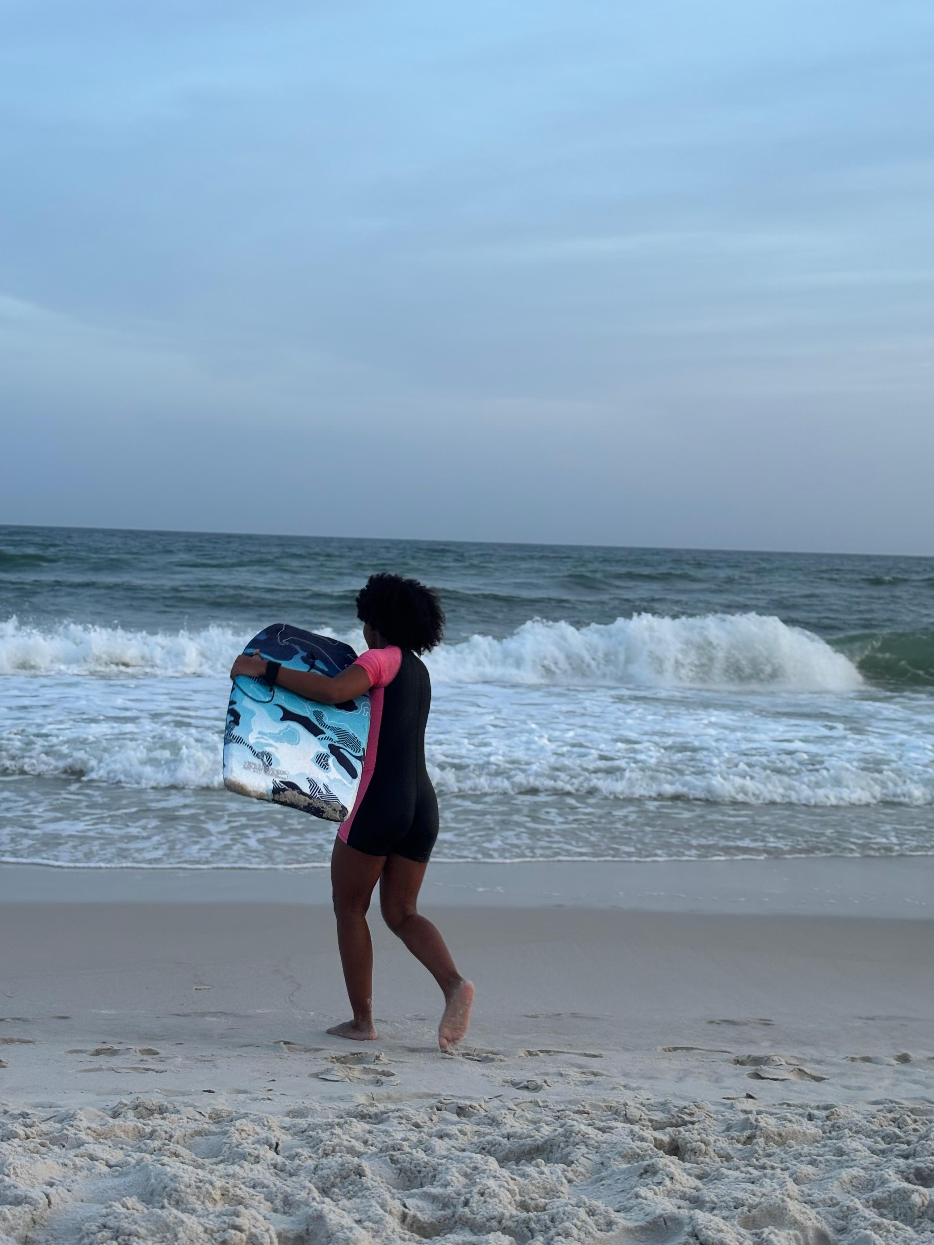 Using the Cove202 skimboard at the beach within walking distance to the condo after dinner